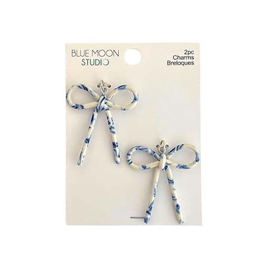 Blue Moon Studio™ Blue & White Acrylic Bow Charms, 2ct.